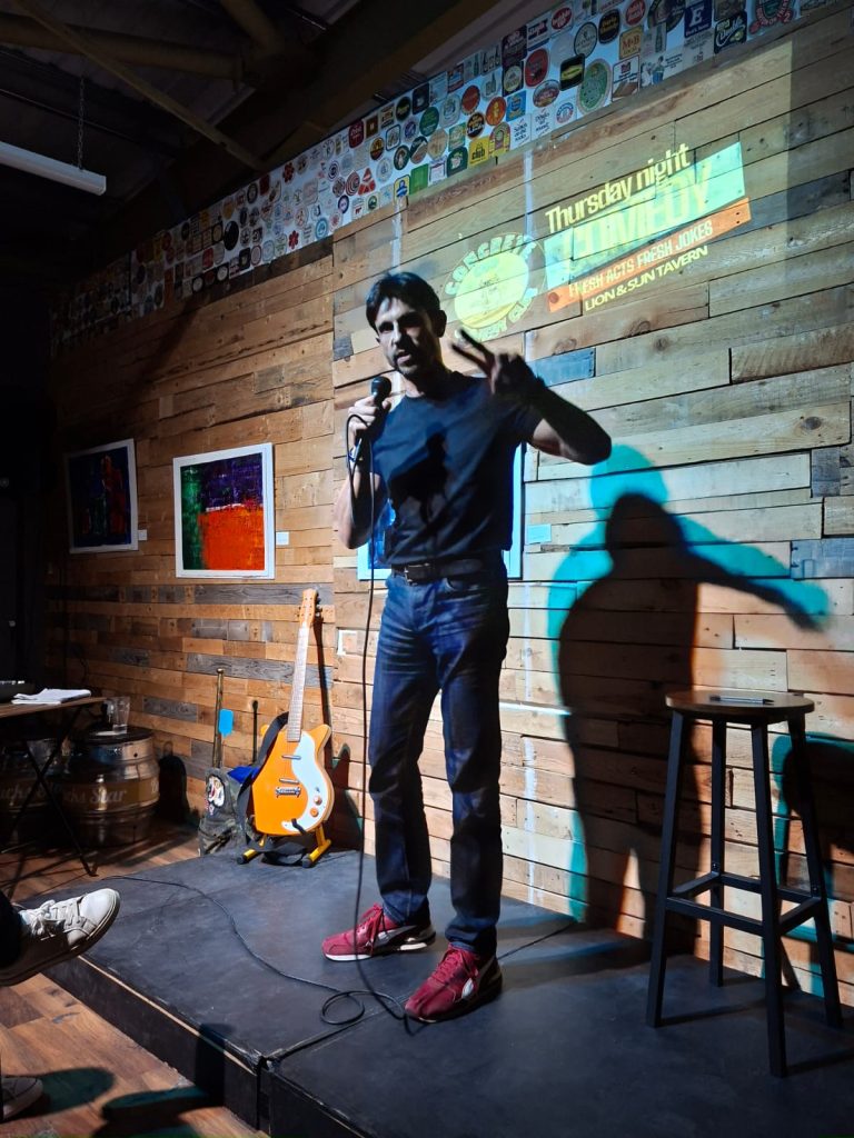 Ben performing stand-up at the Concrete Cud